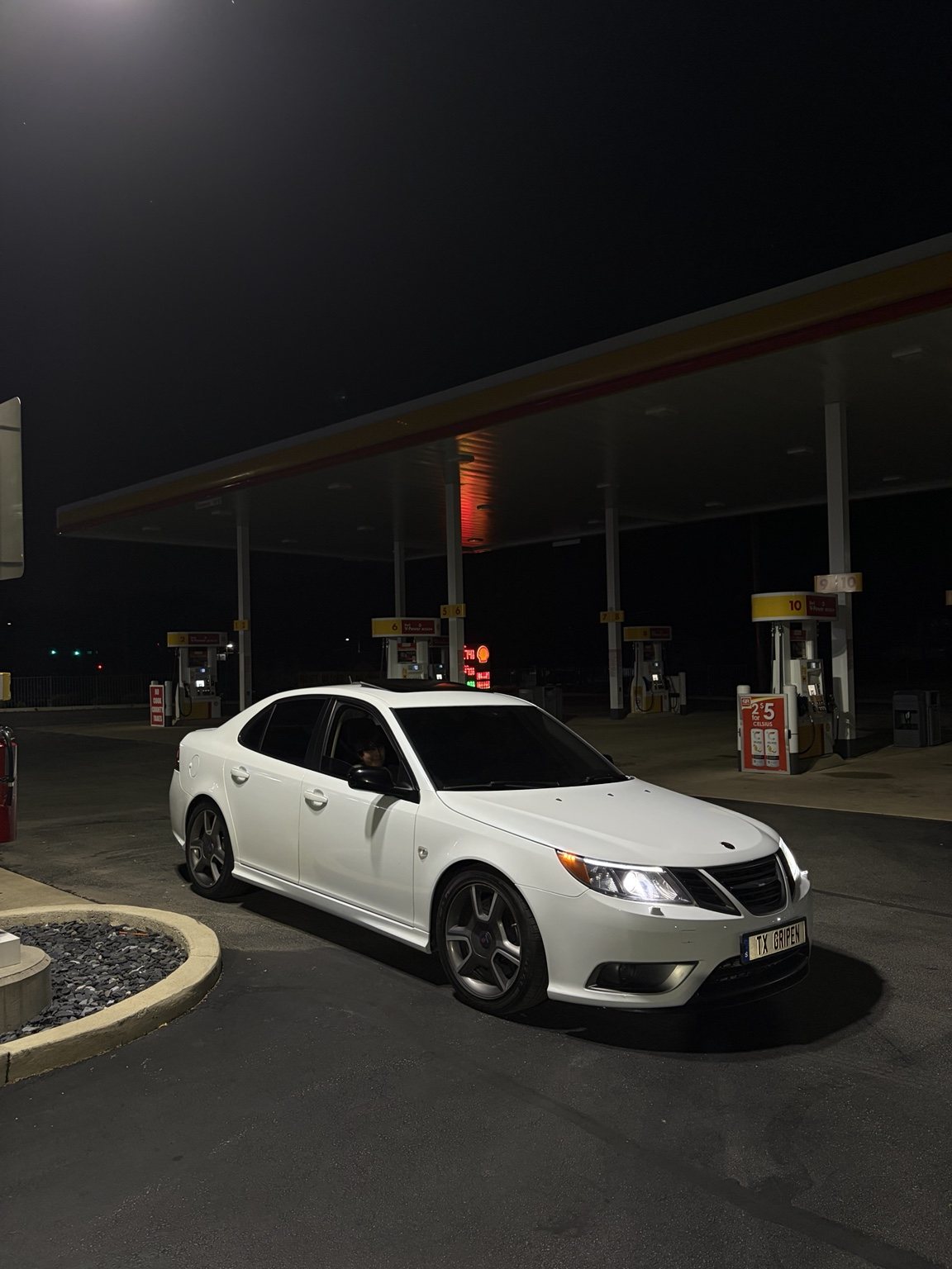 White Saab at night